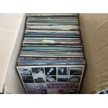 A box of LPs by various artists including Bryan Ad