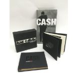 Two Johnny Cash CD box sets comprising 'Unearthed'