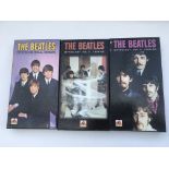 Three Beatles 'Mythology' CD long box sets.