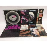 Eight rock LPs by various artists including Queen,