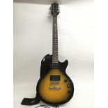 An Epiphone Les Paul electric guitar with soft car