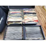 3 Record cases of 7" singles.