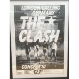 A framed poster of The Clash promoting a concert i