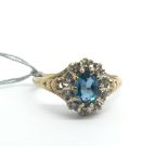 A 9ct yellow gold, topaz and diamond cluster ring