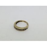 A 10ct gold Half eternity ring set with 9 diamonds
