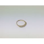 An 18ct gold half hoop eternity ring set with 7 fi