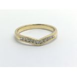 An 18ct yellow gold and diamond wishbone ring, app