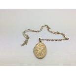 A 9ct gold oval locket on chain, approx total weig