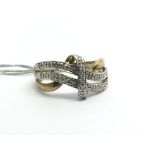A 9ct yellow gold ring set with diamond bands, app