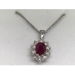 An 18ct white gold oval-cut ruby and RBC diamond c