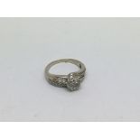 An 18ct white gold ring set with a rose shaped dia