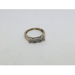 A 9ct gold ring set with 3 diamonds approx 0.15ct.