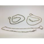 Three foreign silver watch chains.