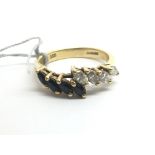 An 18ct yellow gold and marquise cut sapphire and
