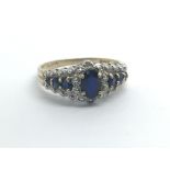 A 9ct yellow gold ring set with sapphires and diam