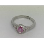 An 18ct white gold oval-cut pink sapphire 0.51ct.
