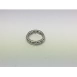 An 18ct white gold full eternity ring set with dia