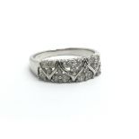 An 18ct white gold and diamond half eternity clust