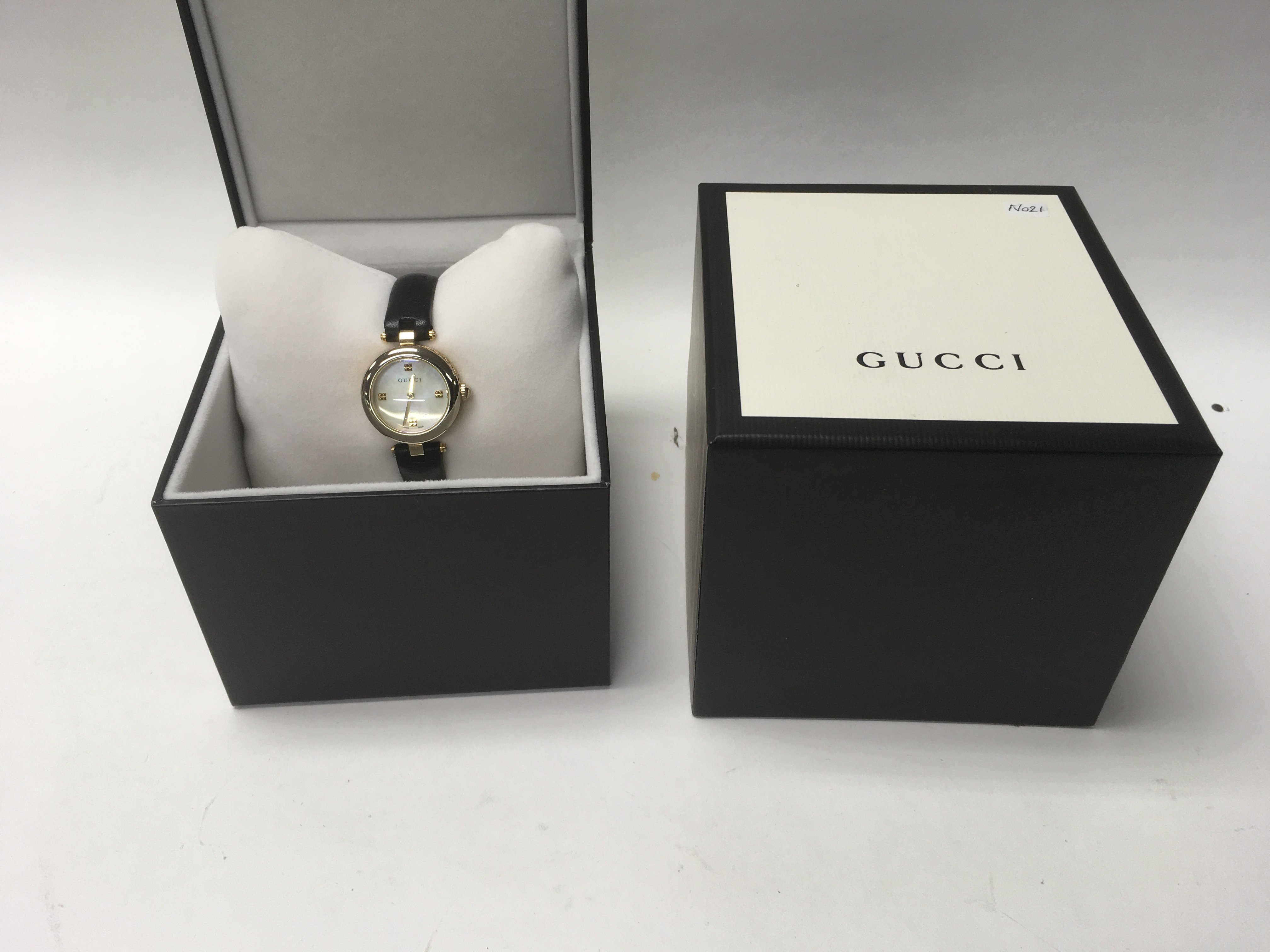 A boxed ladies Gucci diamantissima wrist watch