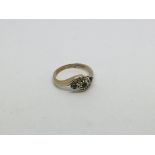 A 9ct gold ring set with 3 emeralds and diamond tw