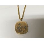 A 9carat gold locket with floral decoration and at