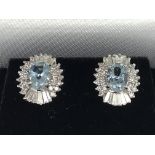 A pair of white gold aqua marine and diamond halo