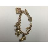 A 9 ct gold charm bracelet 30 grams