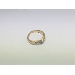 An 18ct gold Wish bone design ring set with 7 diam