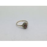 A 9ct gold ring set with a ruby and diamond cluste