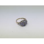 A 14ct gold ring set with amethyst and diamond clu