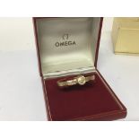 A 9carat gold ladies Omega watch in a fitted case
