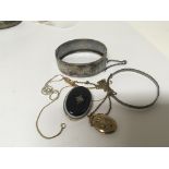 A Silver bangle antique mourning brooch a gold fro