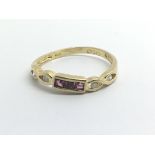 An 18ct yellow gold ruby and diamond ring, weight