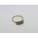 An 18ct gold ring set with 7 old cut diamonds appr