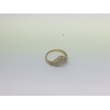 An 18ct gold fan shaped 0.5ct diamond ring. Size h