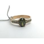 A 14ct yellow gold ring set with central tourmalin