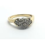 An 18ct yellow gold and diamond cluster ring, appr