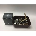 A box containing various watches and a boxed men's