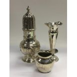 A silver sugar caster, cream jug and a bud vase (3