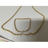 A 9carat gold rope chain necklace with conforming