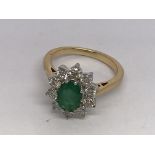 An 18ct yellow gold oval-cut emerald and RBC diamo