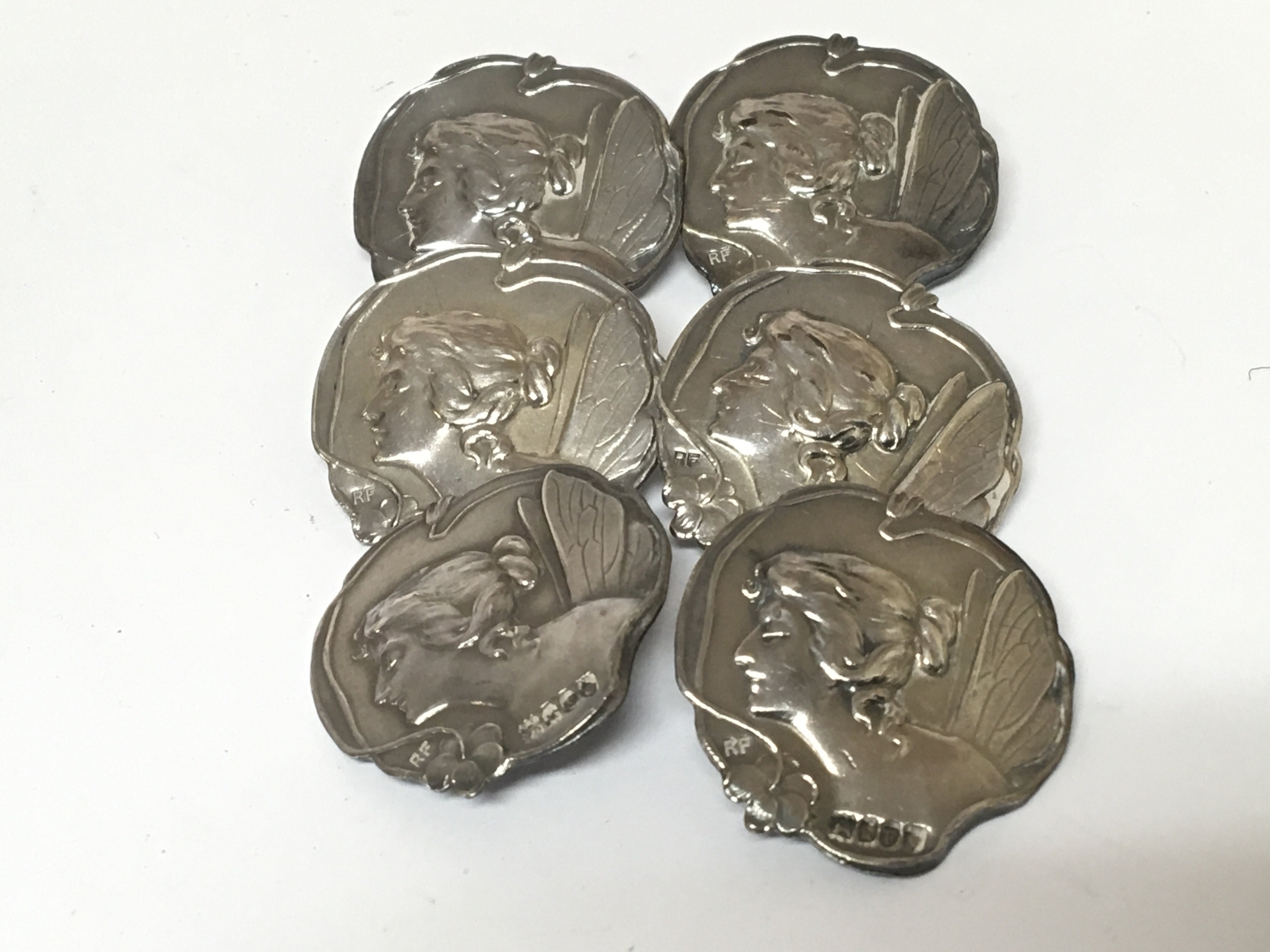 A set of six Art Nouveau silver buttons. London 19