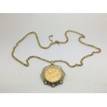 A 1910 gold full sovereign in a pendant mount with