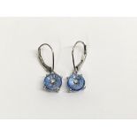 A pair of 10k white gold and blue stone earrings