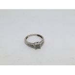 An 18ct white gold ring set with baguette cut and