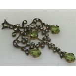 A chandelier-style pendant set with peridots, diam