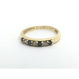 An 18ct yellow gold half eternity ring with altern