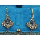 A pair of flared drop earrings set with diamonds a