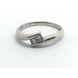 An 18ct white gold set with two princess cut diamo