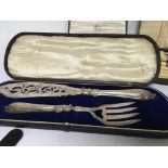 A cased set fish serving slice and folk and cased